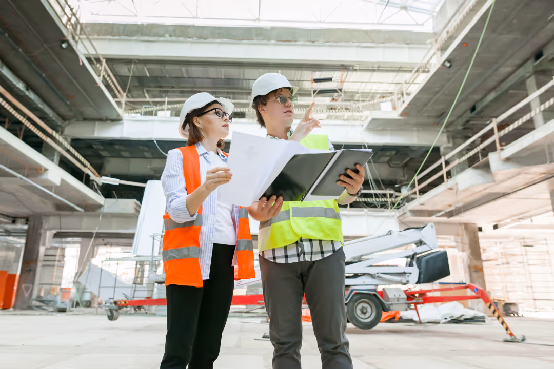 two engineers in hardd hats examine plans to run better meta ads for facebook and instagram