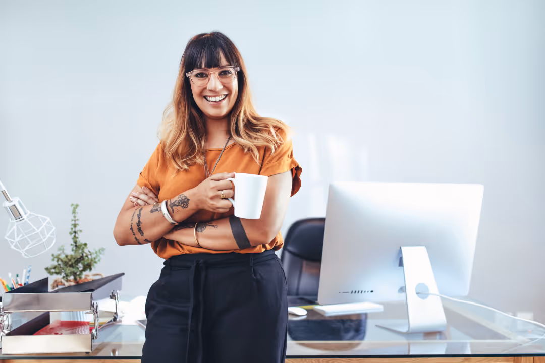 Woman with tattoos and mug looks for best practice meta ads manager settings 2025