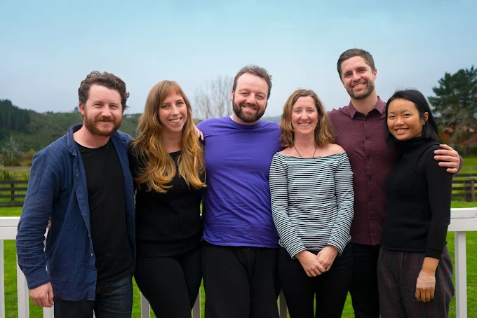 Bamboo Creative team in 2019, six people huddled together smiling