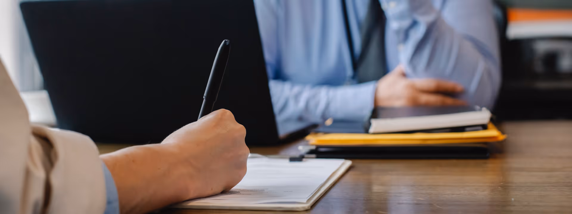 client completing documents with conveyancer