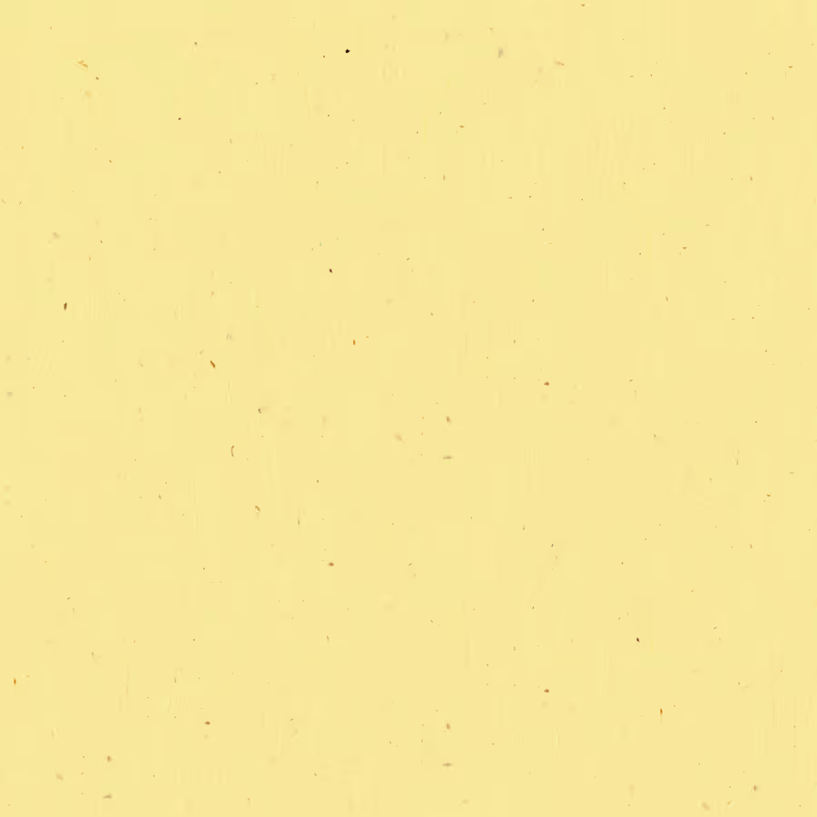 Light yellow textured paper background with small scattered brown speckles.