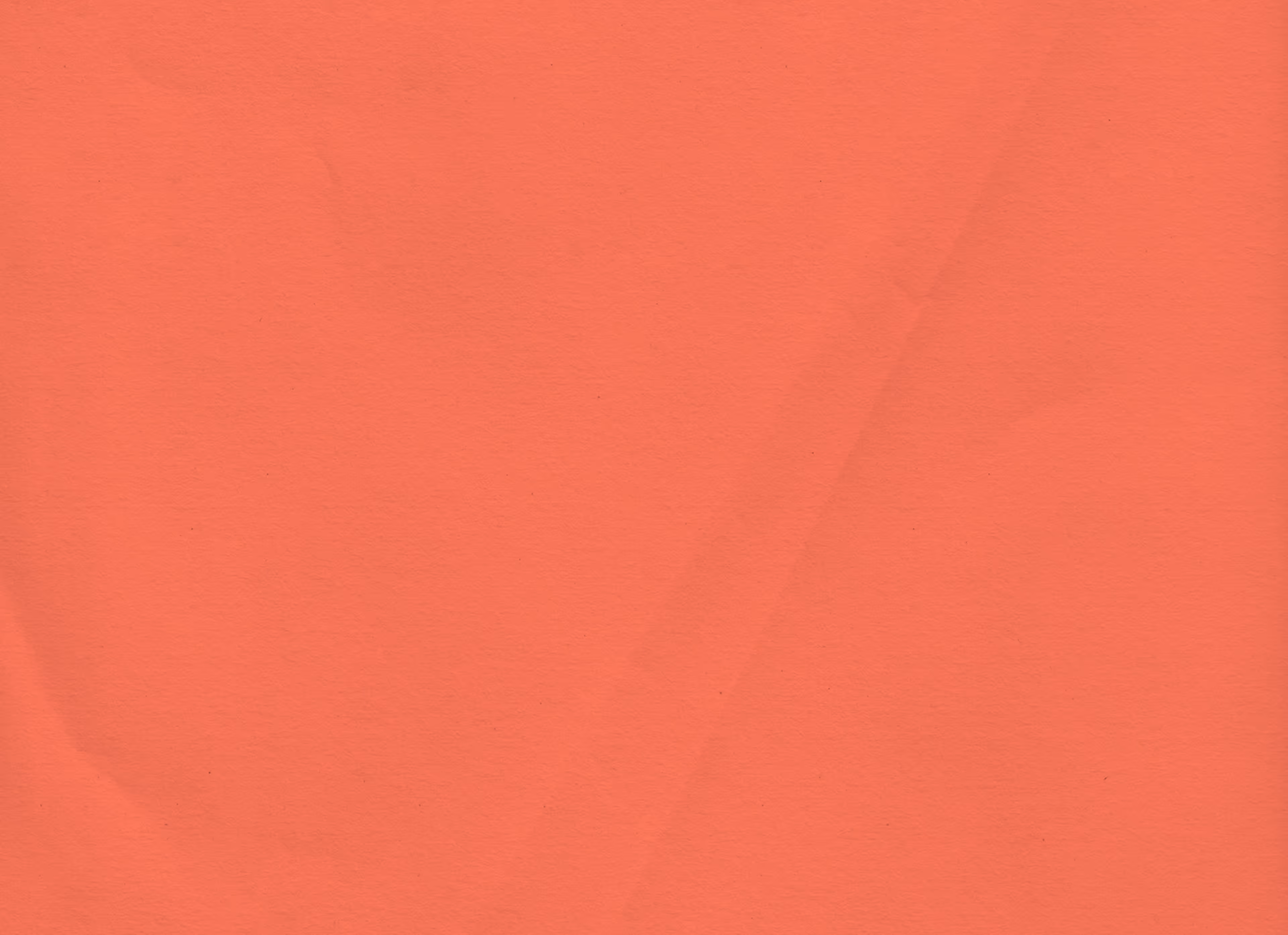 Close-up of crumpled apricot-colored tissue paper.