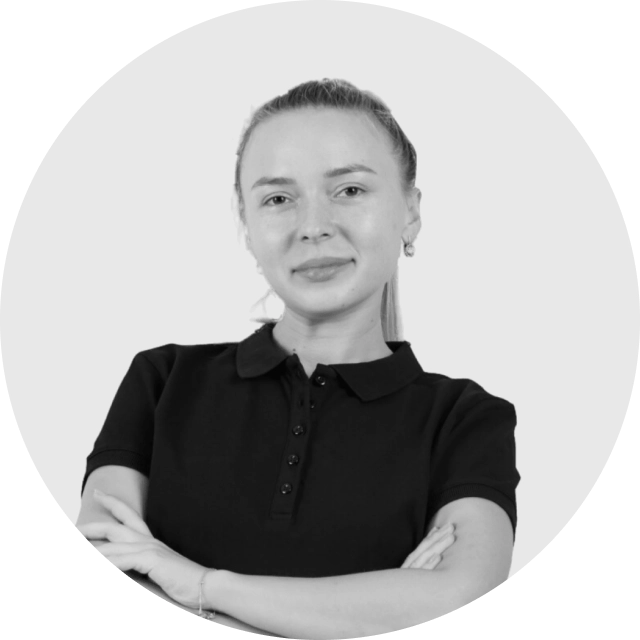 Professional profile photo of a person smiling in business attire