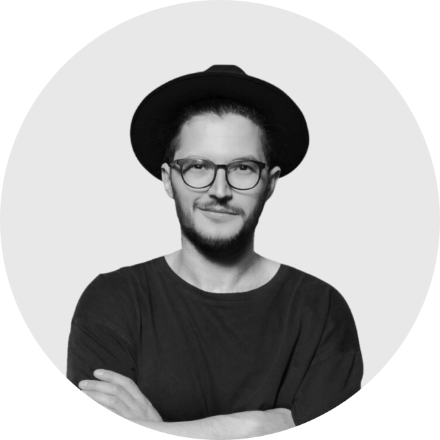 Professional profile photo of a person smiling in business attire