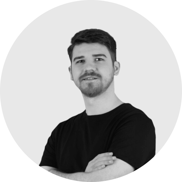 Professional profile photo of a person smiling in business attire