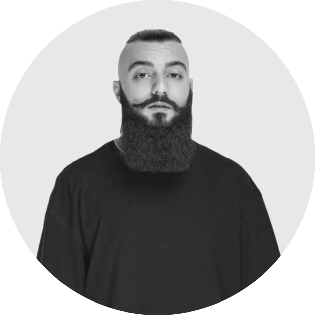 Professional profile photo of a person smiling in business attire