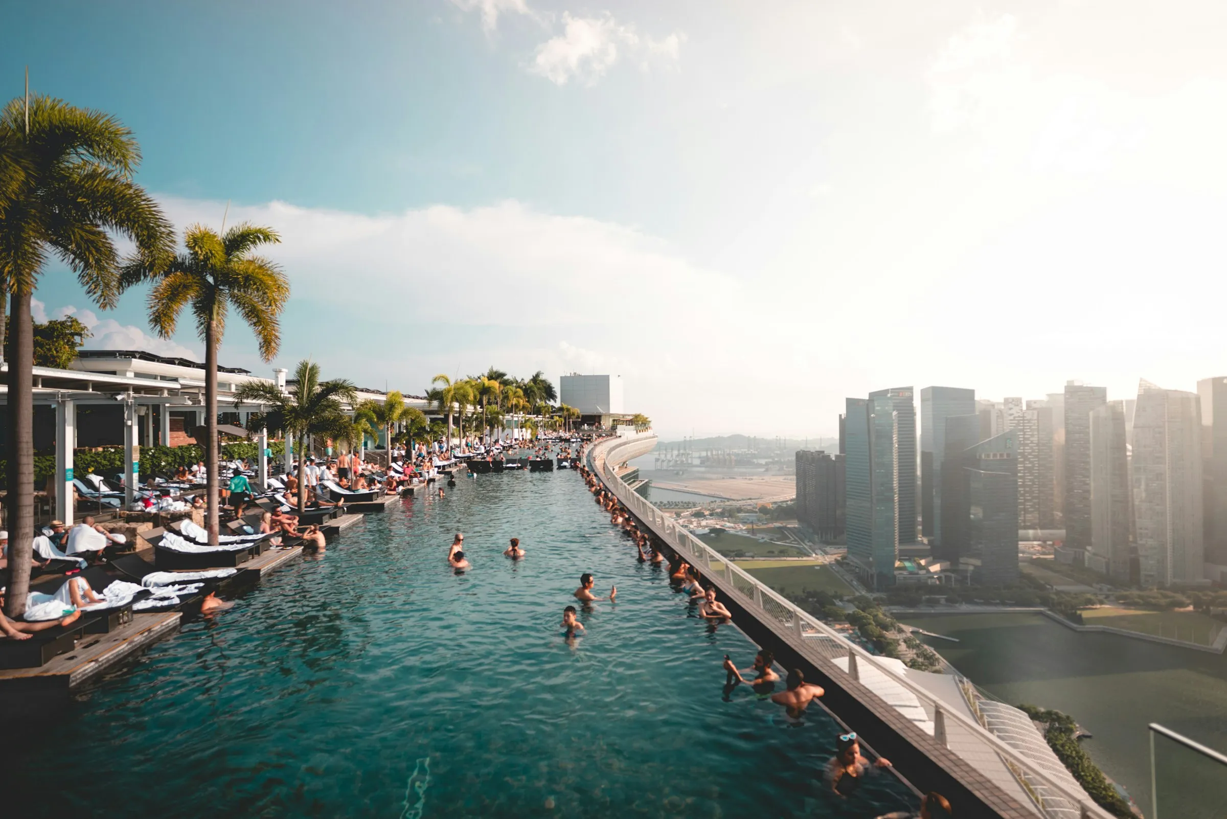 Luxurious infinity pool at Marina Bay Sands Hotel, overlooking the stunning skyline of Singapore.