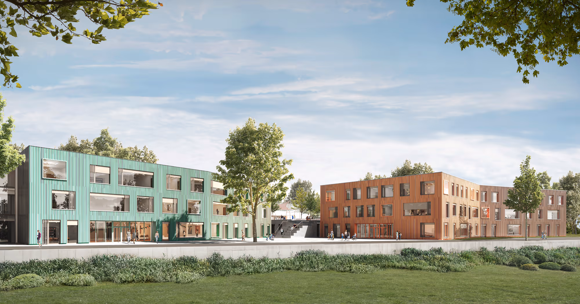 Zwei moderne, mehrstöckige Förderzentren mit grüner und brauner Fassade umgeben von Bäumen und einer Rasenfläche im Vordergrund.