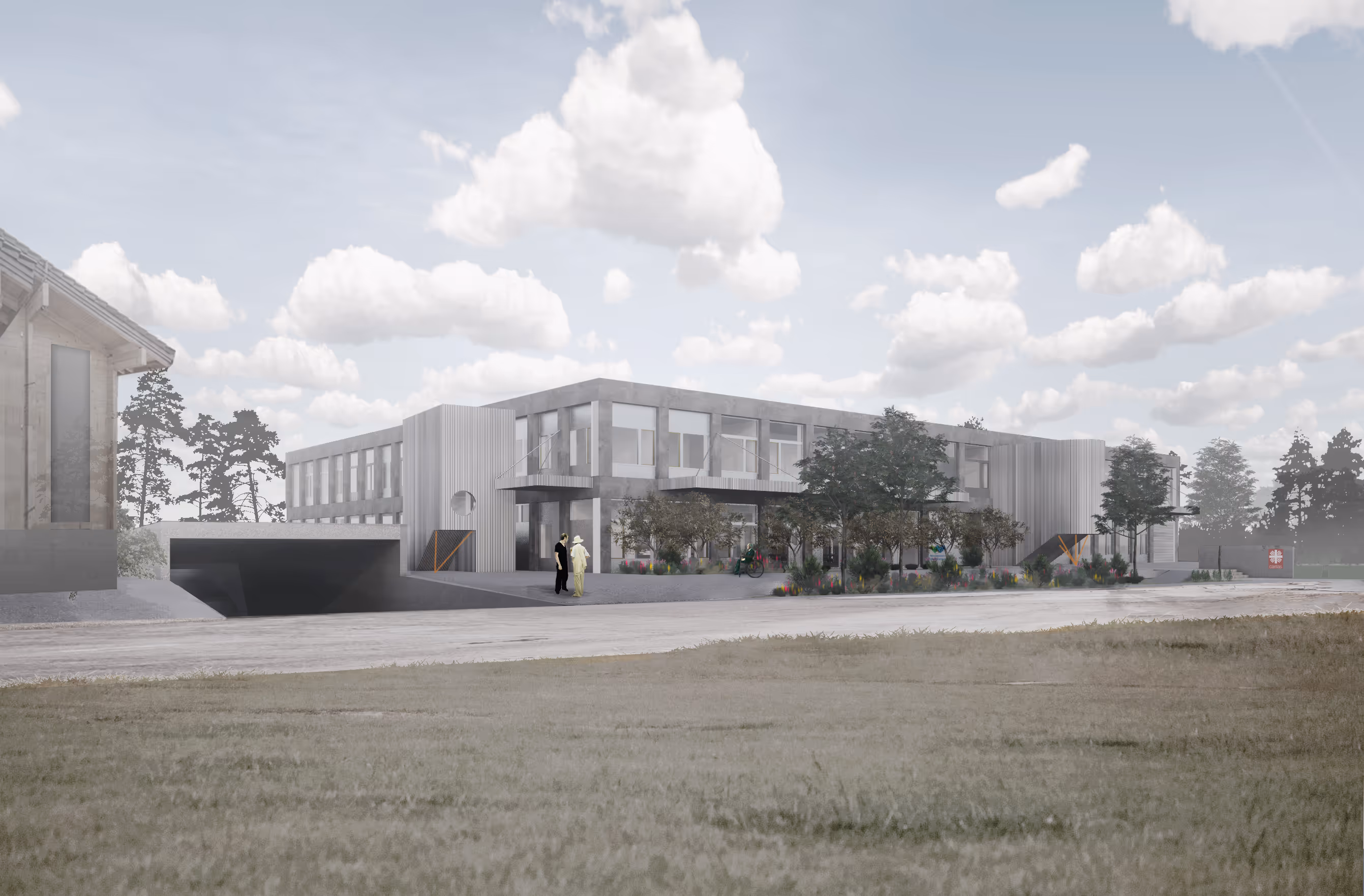 Moderne, zweistöckige Werkstatt mit großen Fenstern, umgeben von Bäumen und einem offenen Rasen unter bewölktem Himmel.