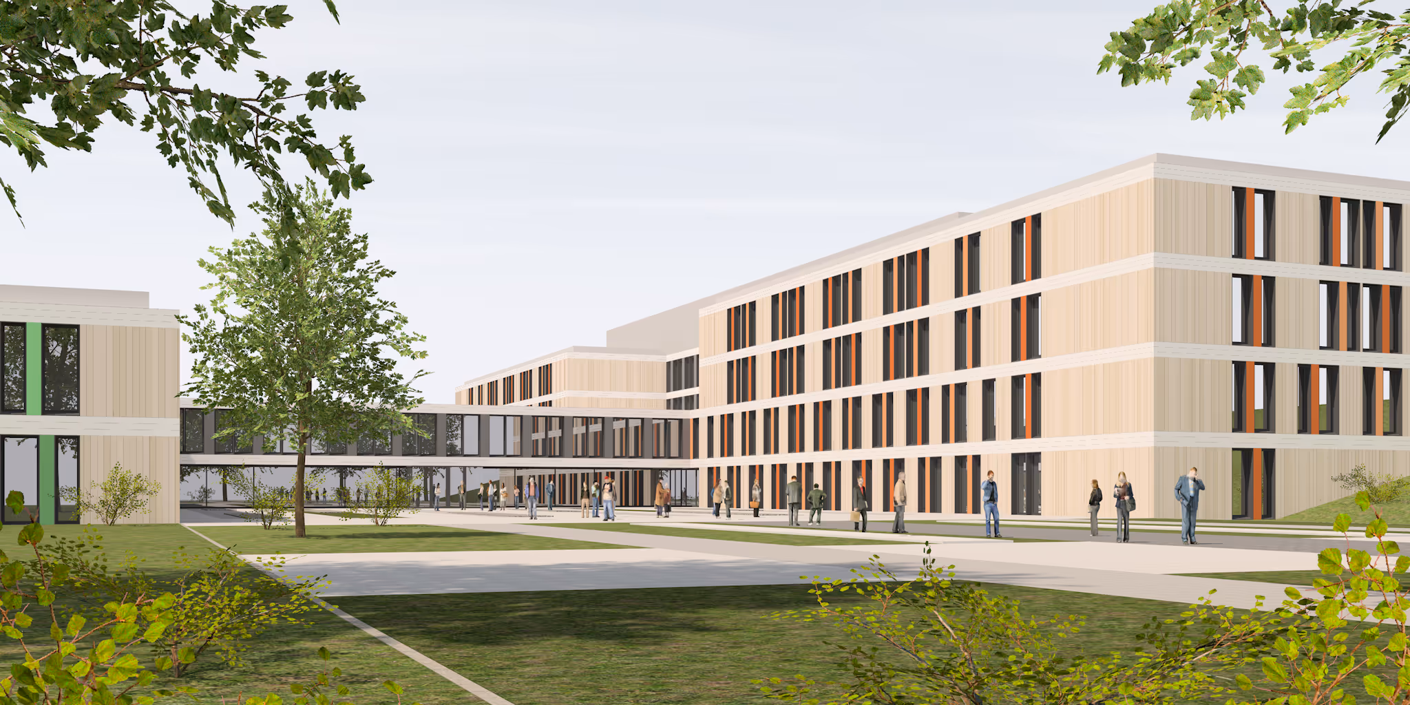 Moderner Bürokomplex mit drei- bis vierstöckigen Gebäuden, grüner Rasenfläche und Menschen auf dem Weg.