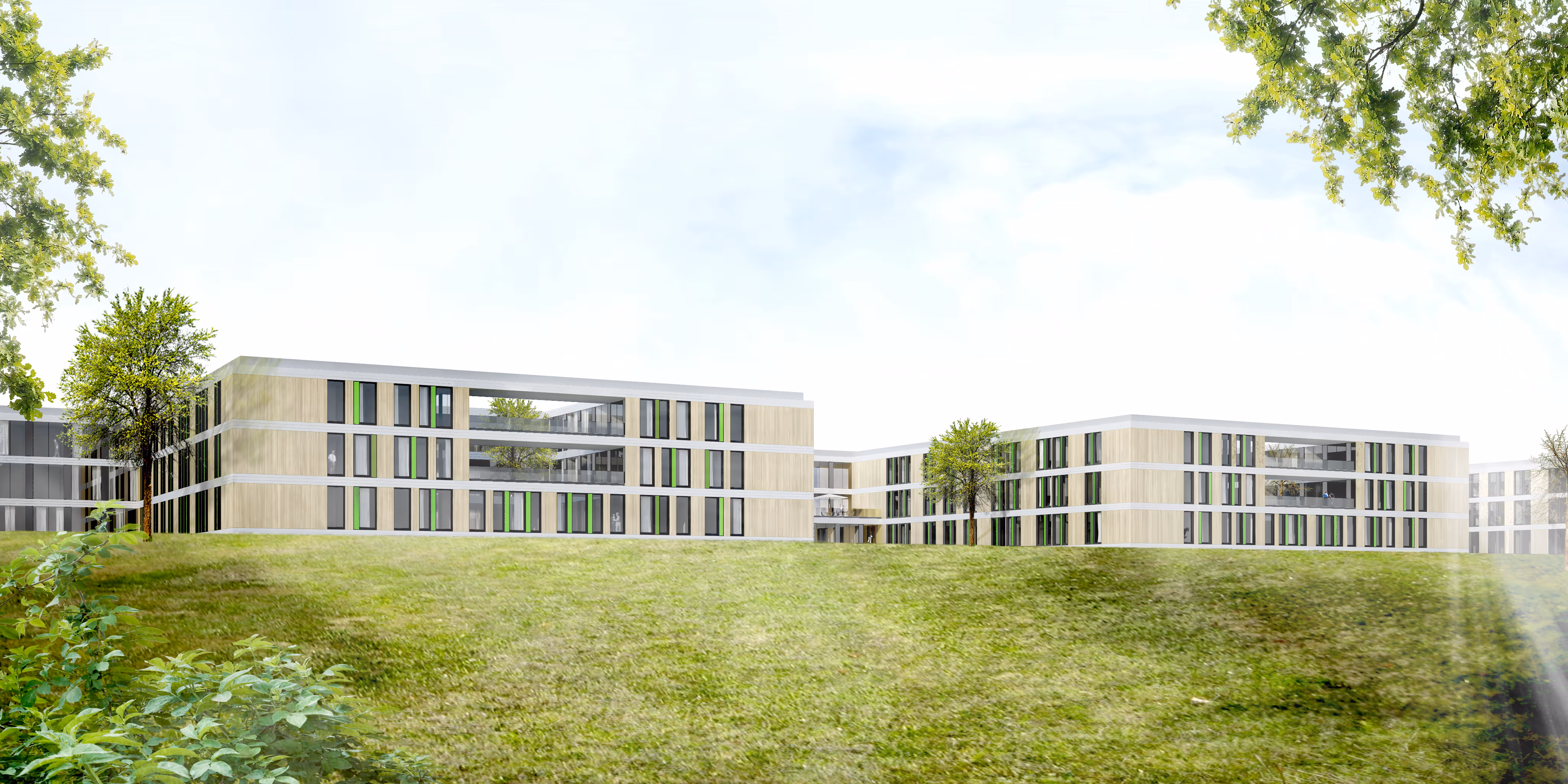 Moderner Gebäudekomplex mit großen Fenstern und grünen Akzenten, umgeben von Rasenflächen und Bäumen.