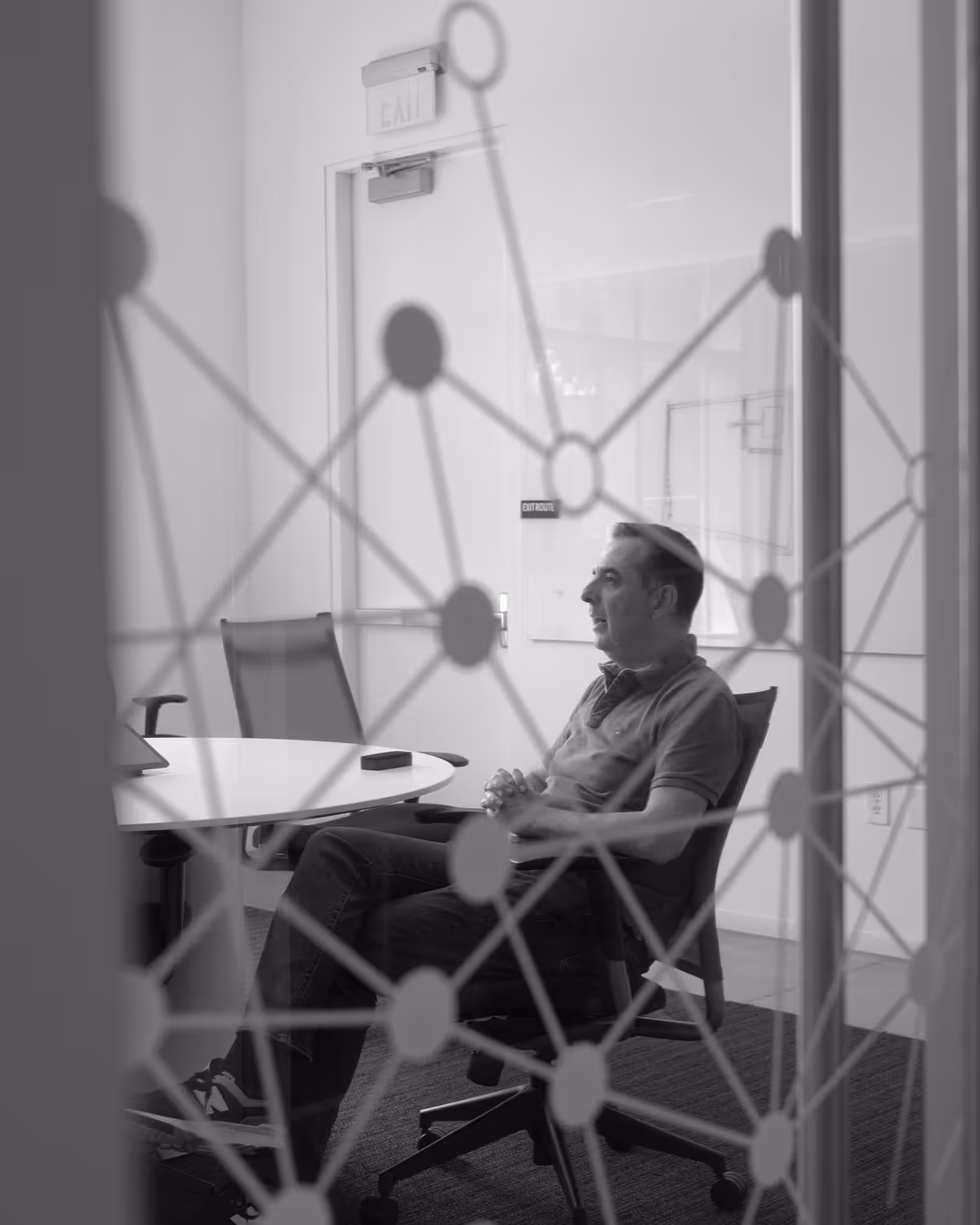 Tensordyne employee in a meeting room at the office.
