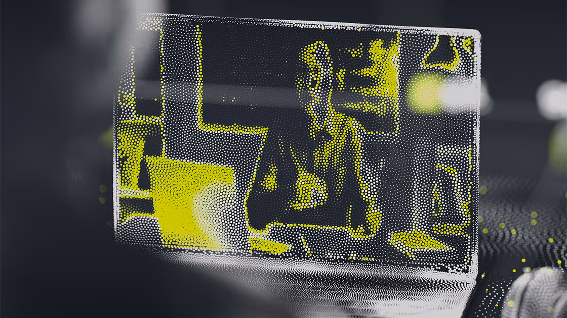Abstract illustration of a person sitting in front of a laptop
