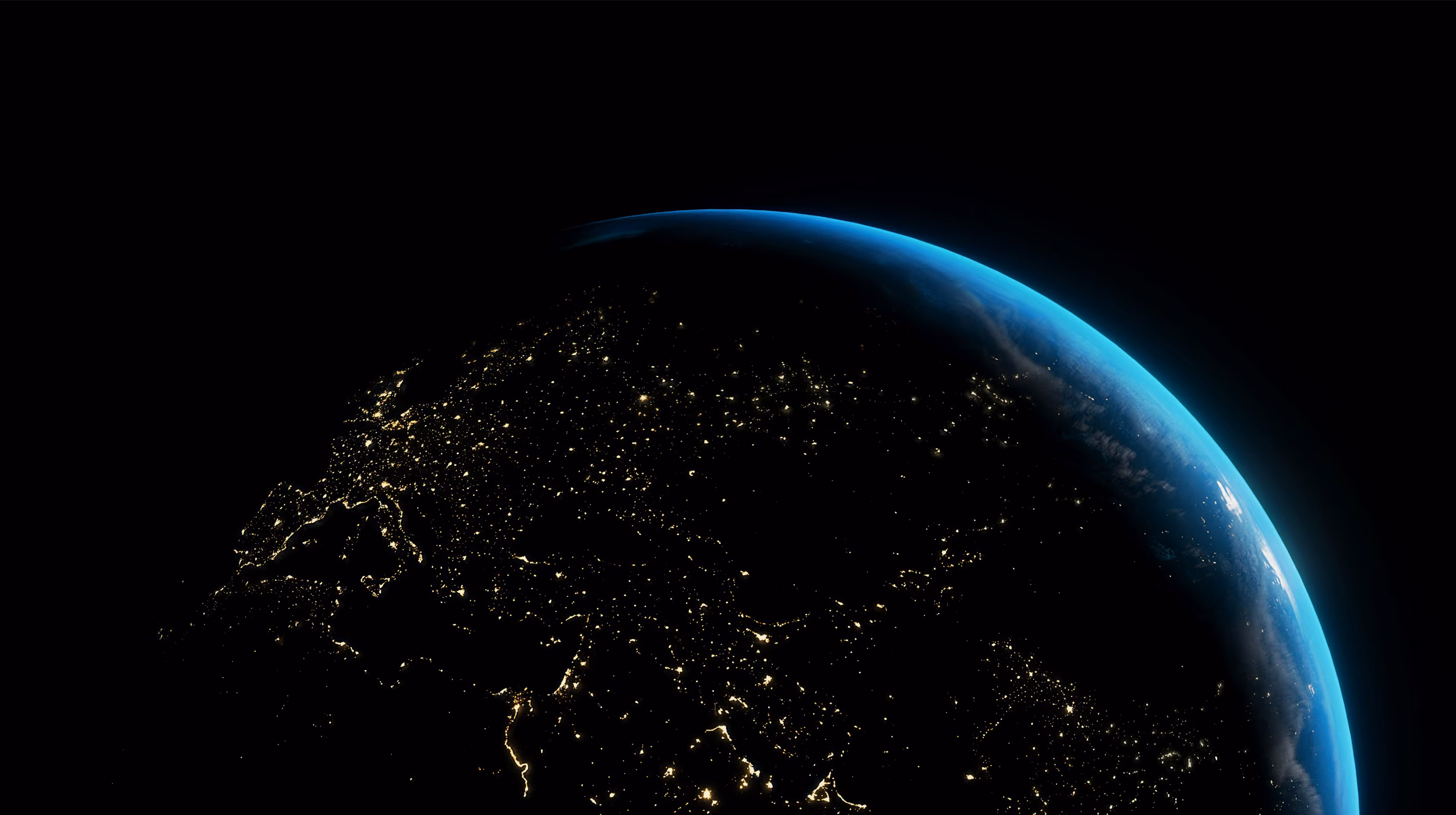 Space view of Earth showing half of the planet with illuminated surface against dark space