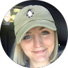 Smiling woman wearing a green cap, representing friendly IT support staff at Red Team IT in Denton TX