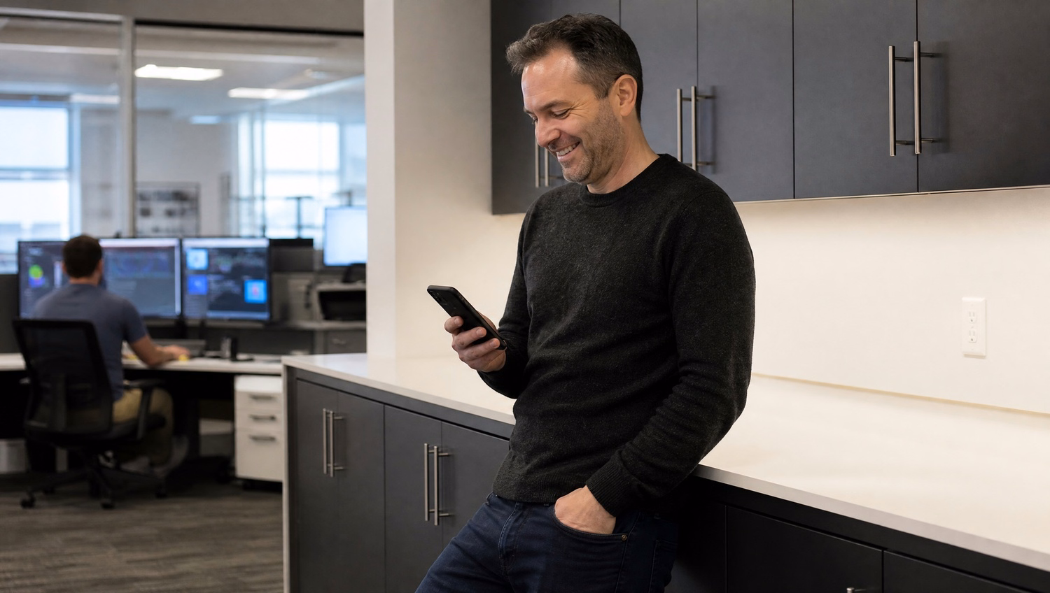 IT consultant checks software updates on smartphone