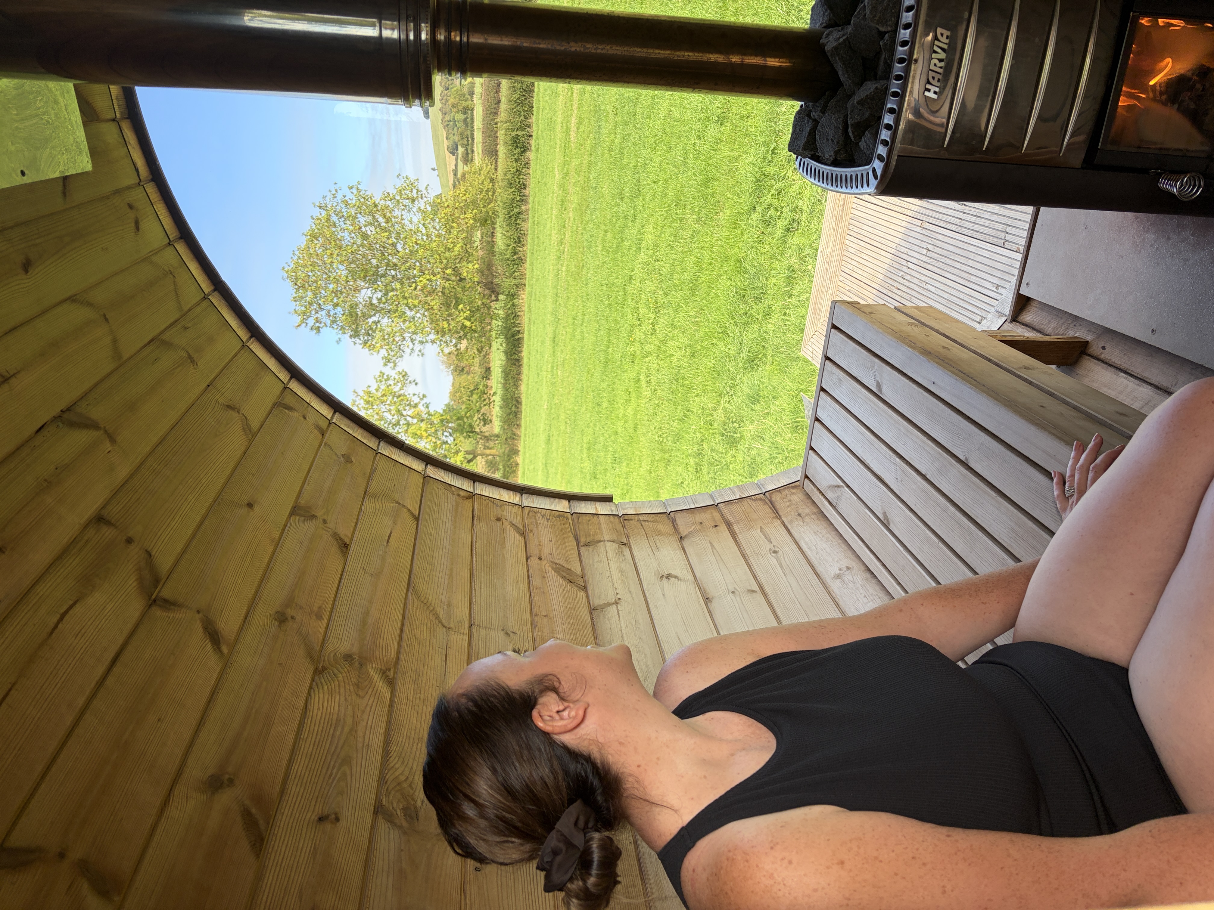 Enjoying the scenery of the outdoor sauna and cold plunge in The Cotswolds