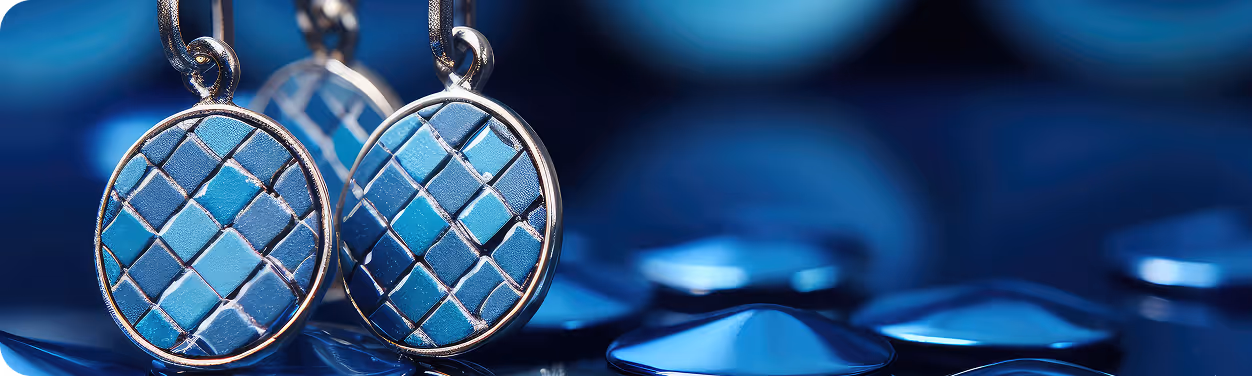 A pair of earrings sitting on top of a table.