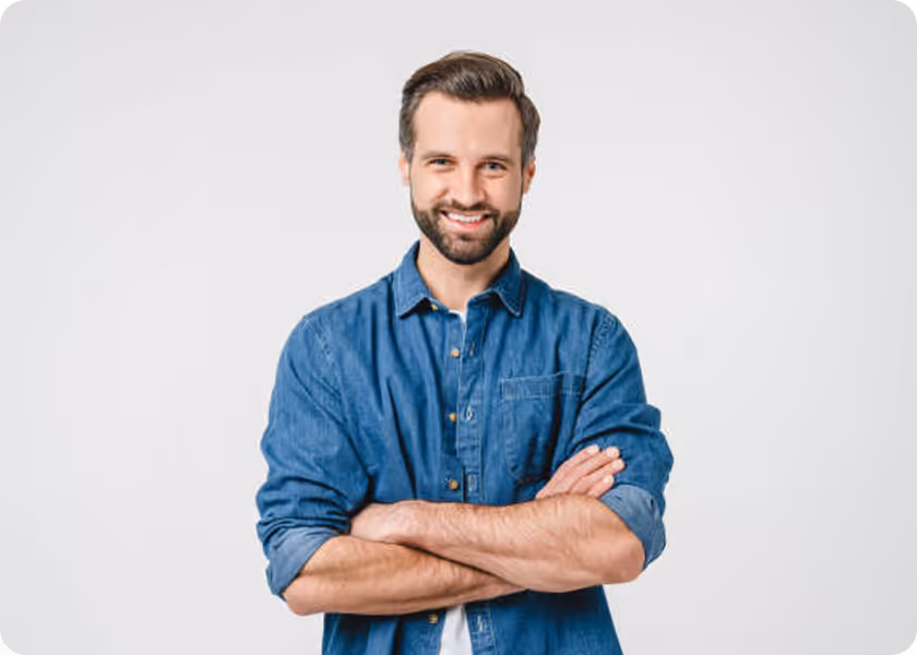 A man with his arms crossed standing with his arms crossed.