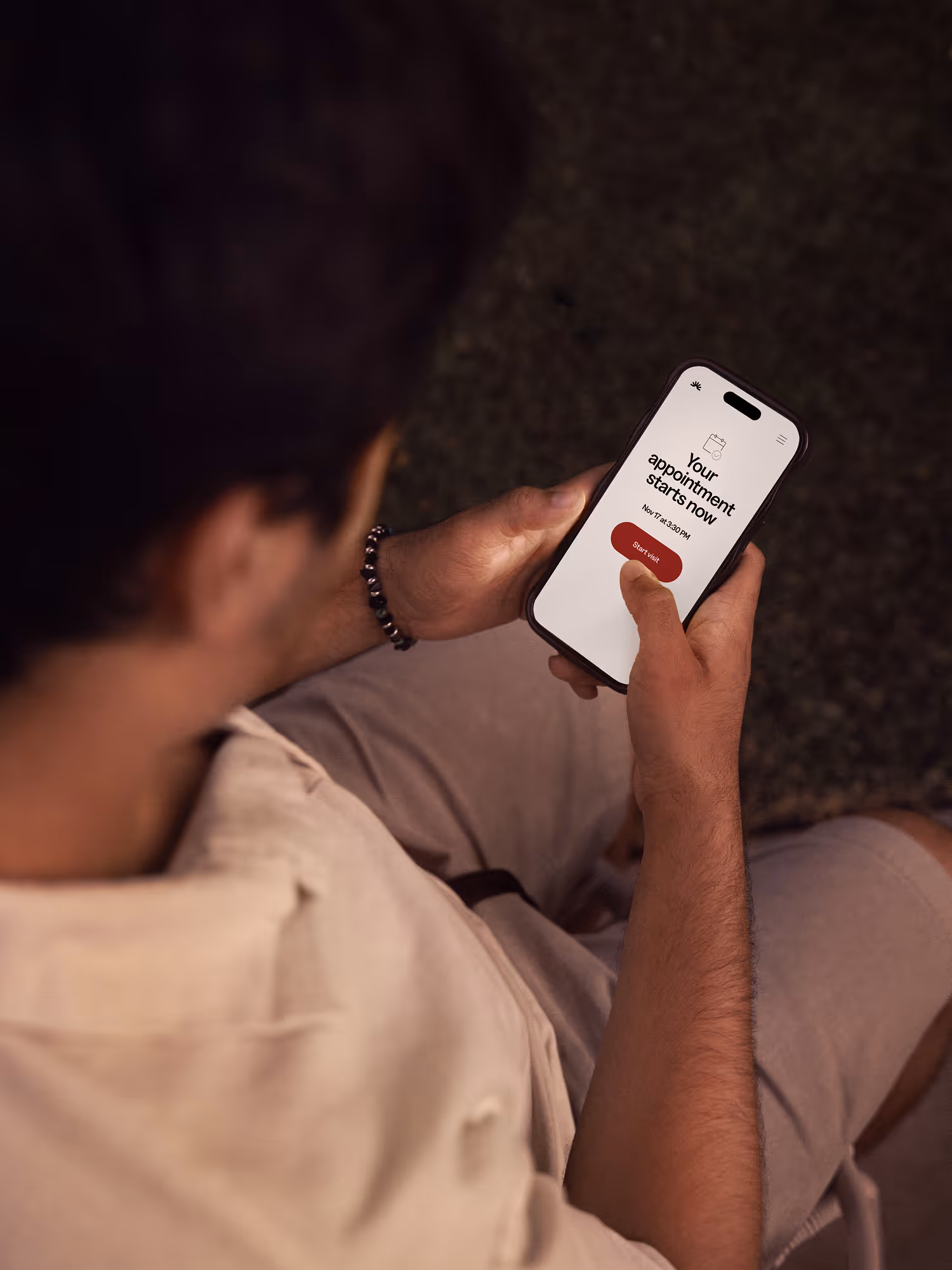 Person holding smartphone booking an appointment with Haven.