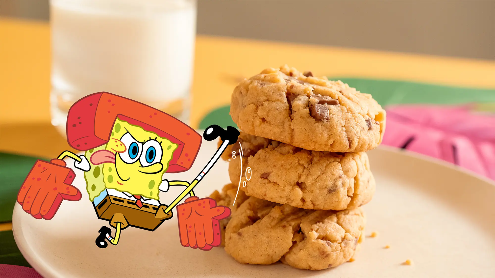 SpongeBob kicks a stack of chocolate butter cookies. 
