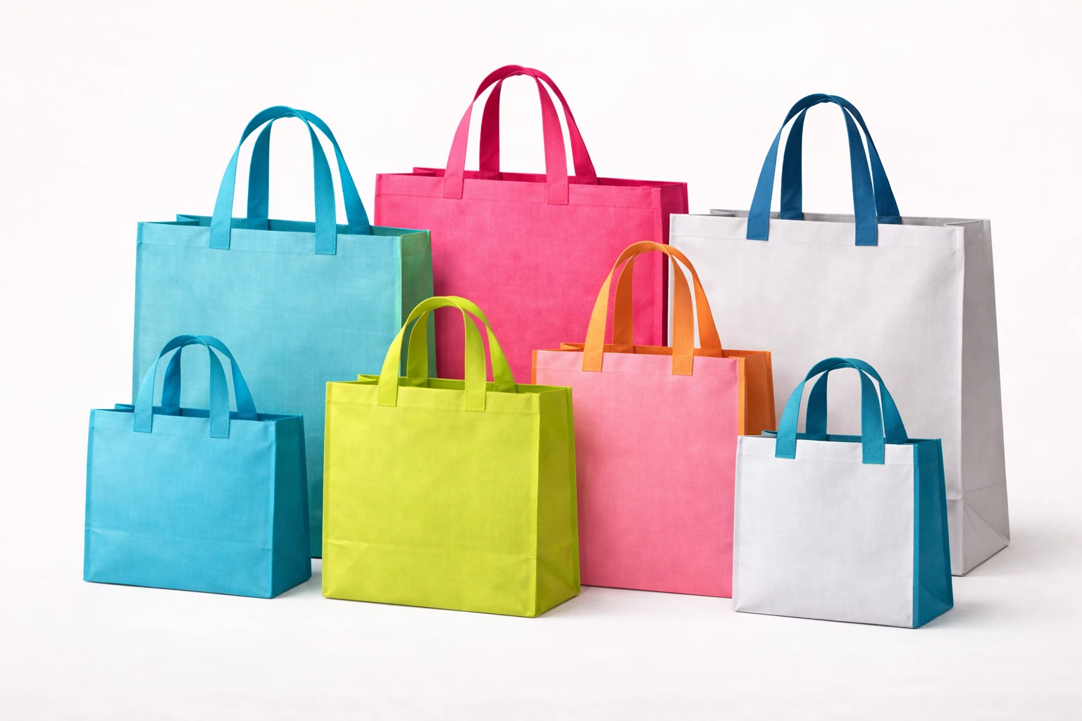Collection of reusable RPET bags in various colors and sizes made from recycled plastic bottles