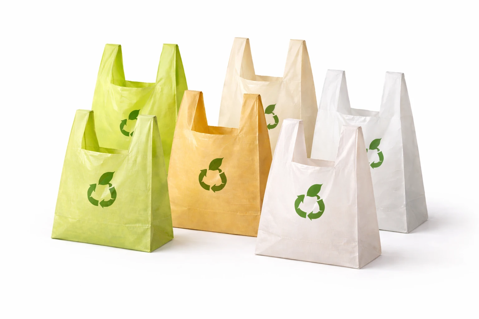 Plant-based compostable shopping bags made from sustainable materials in natural and warm tones