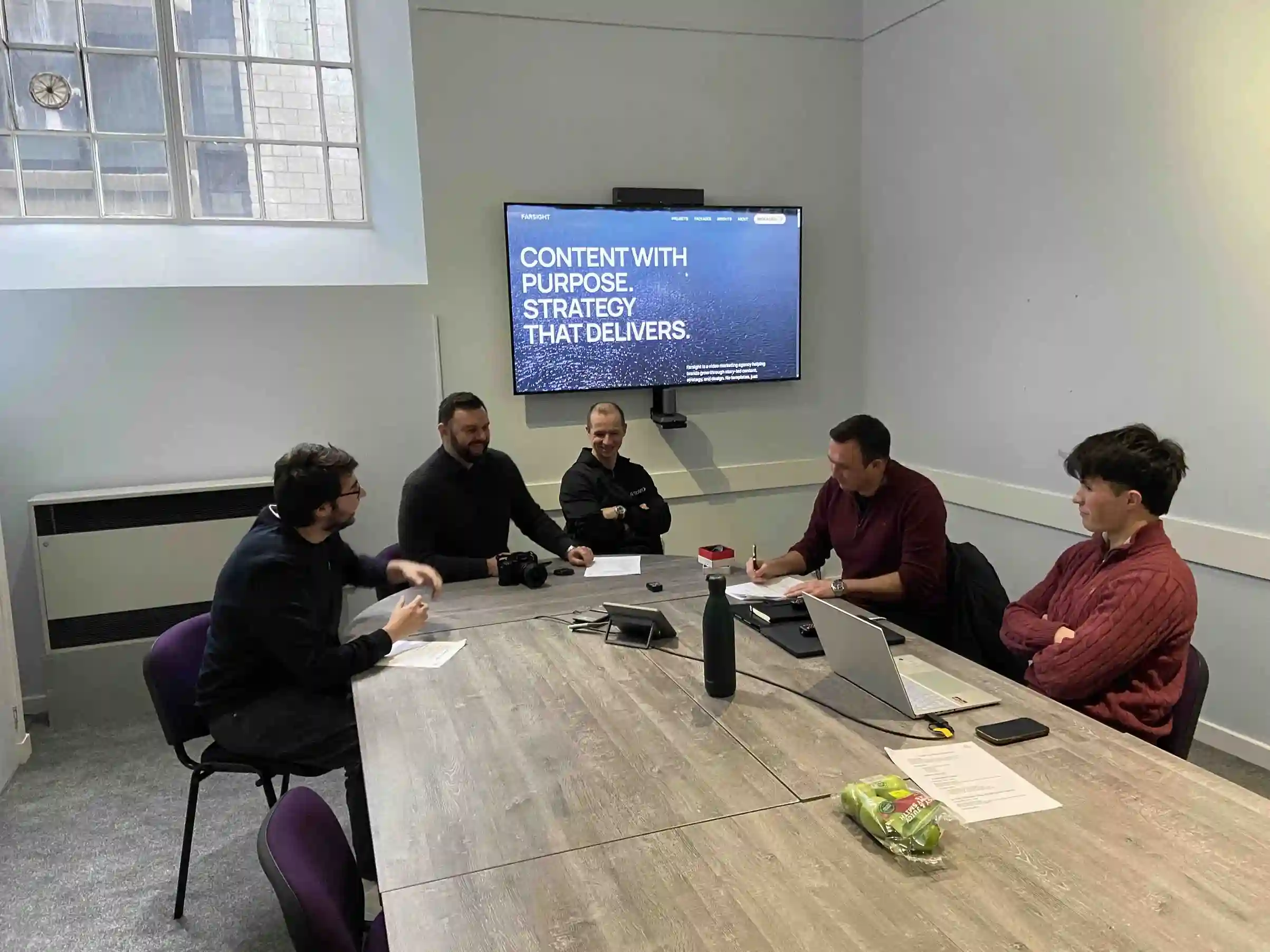 Farsight team in a strategy meeting reviewing content and campaign planning