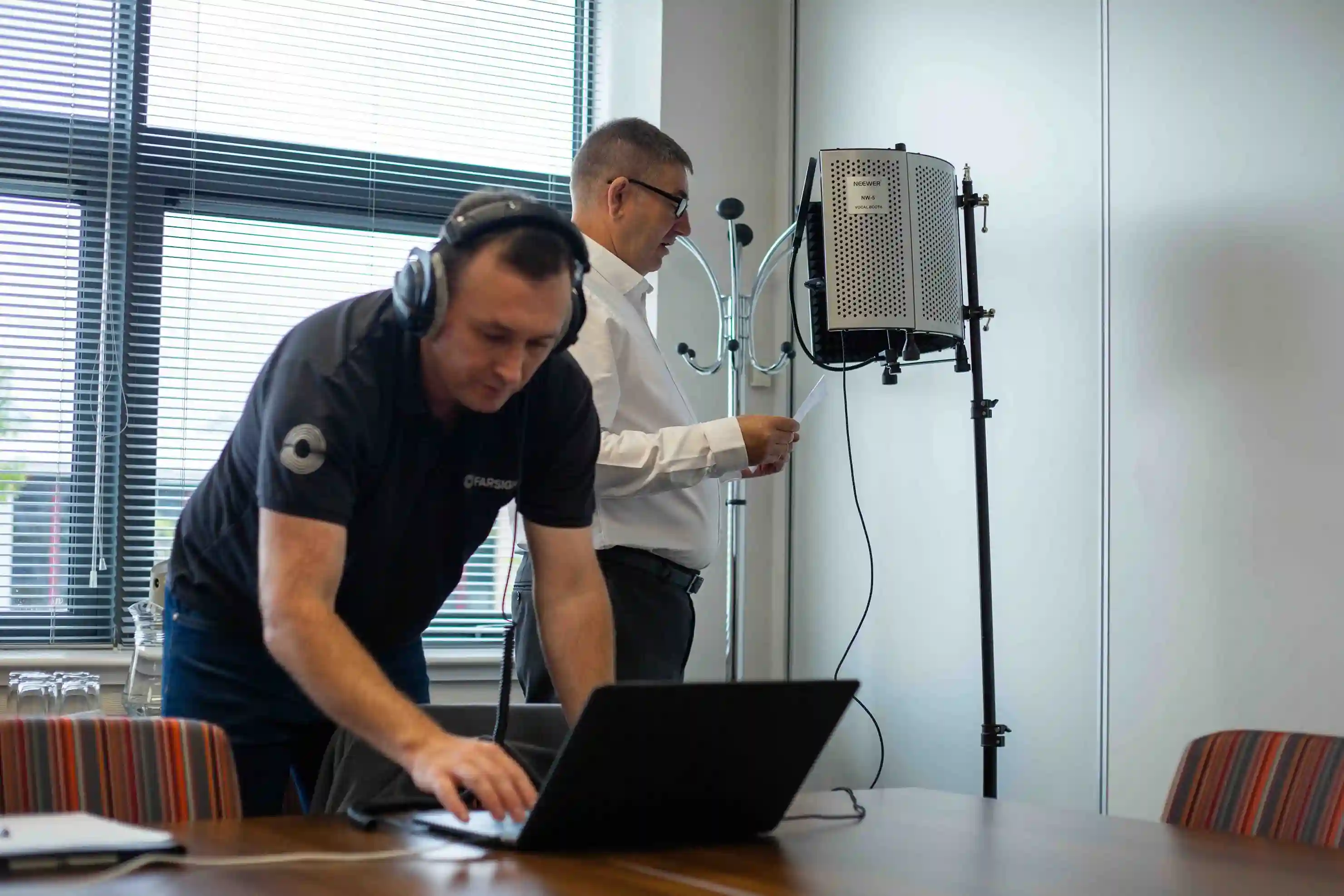 Client recording a testimonial in a portable audio booth, capturing authentic customer voice to build trust and credibility.