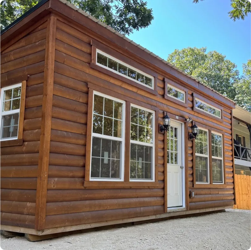 Tiny home finished cabin with log wood siding by Backyard & Beyond in Missouri