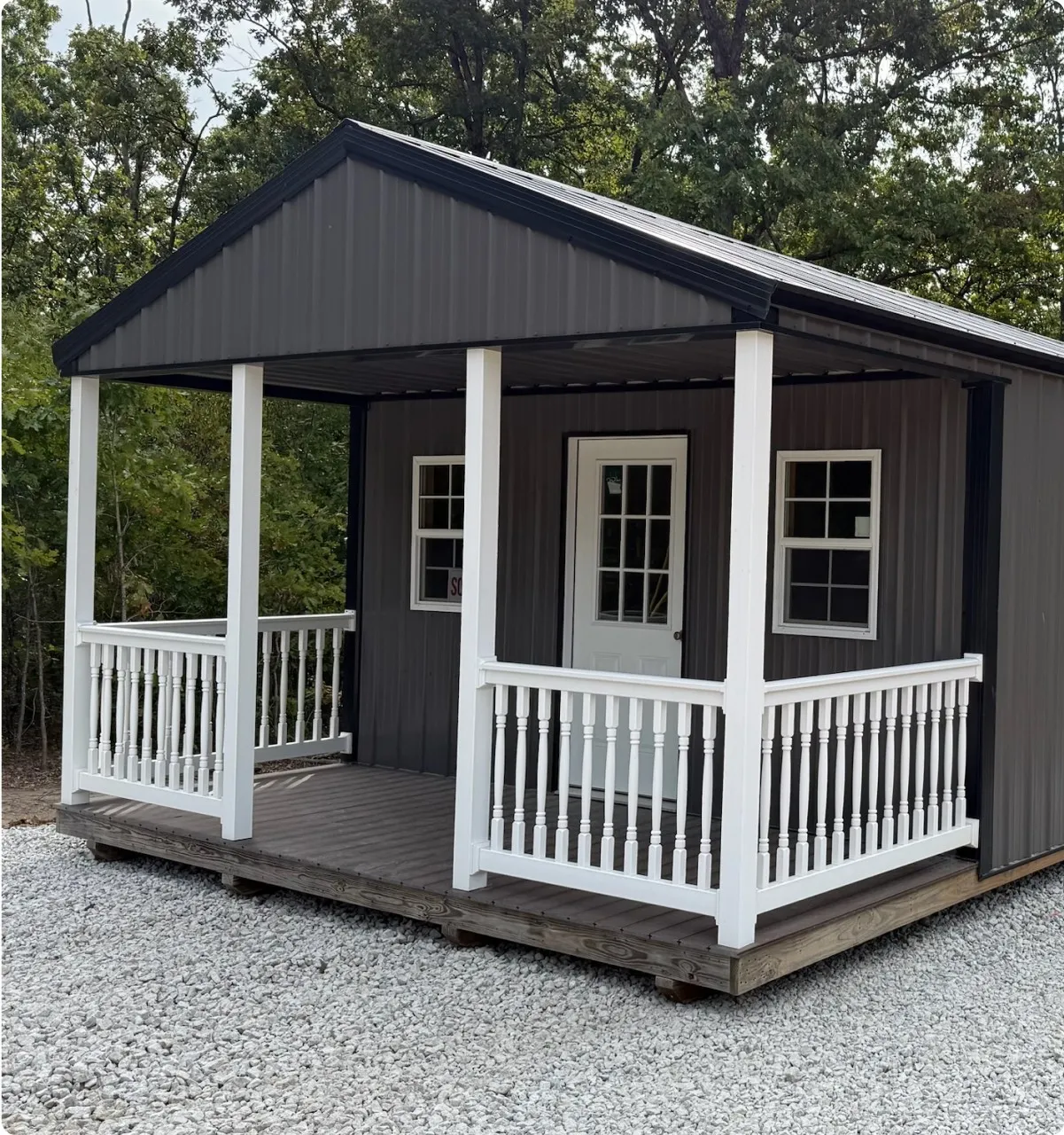 Grey deluxe cabin with porch by Backyard & Beyond in Missouri
