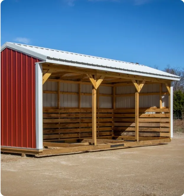 Red metal horse barn by Backyard & Beyond in Missouri