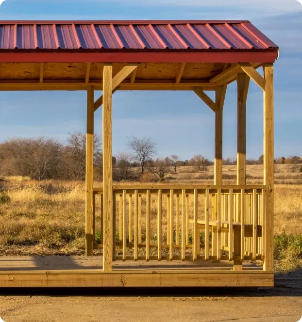 Side view of red wood and metal pavilion by Backyard & Beyond in Missouri