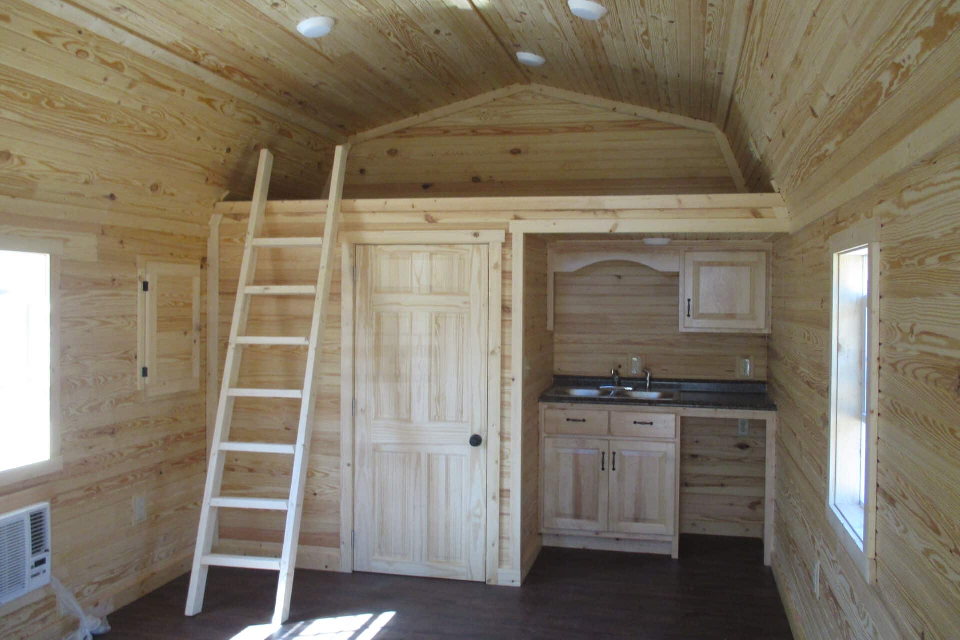 Lofted cabin tiny house with front porch in Missouri