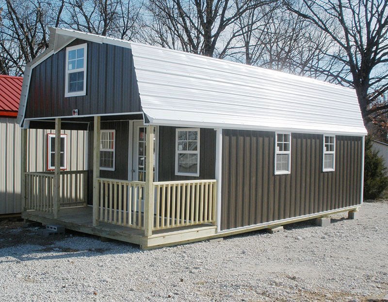 Deluxe high barn cabin with porch railing in Missouri