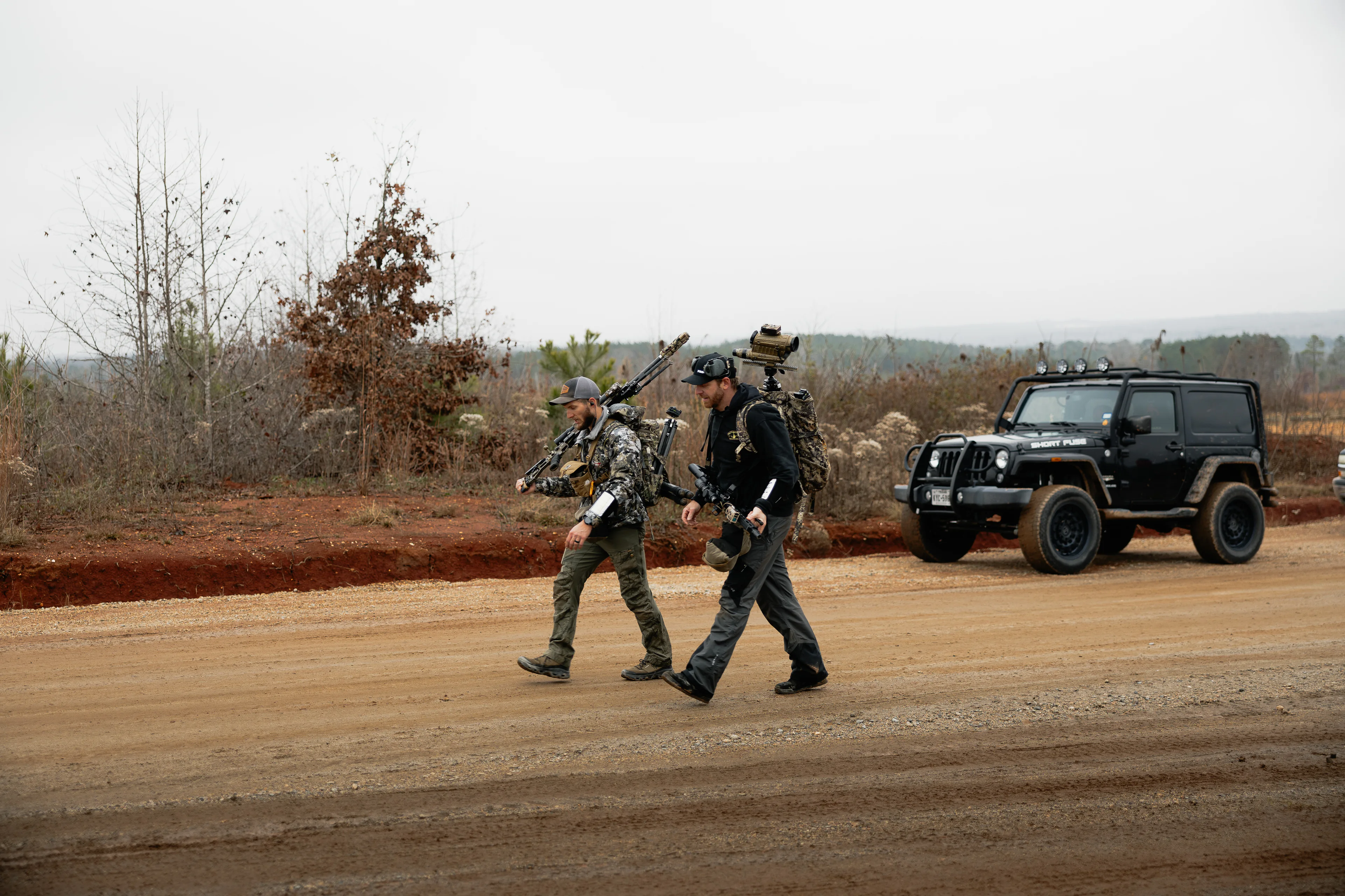 Two-person precision rifle team moving between stages at Colemans Creek