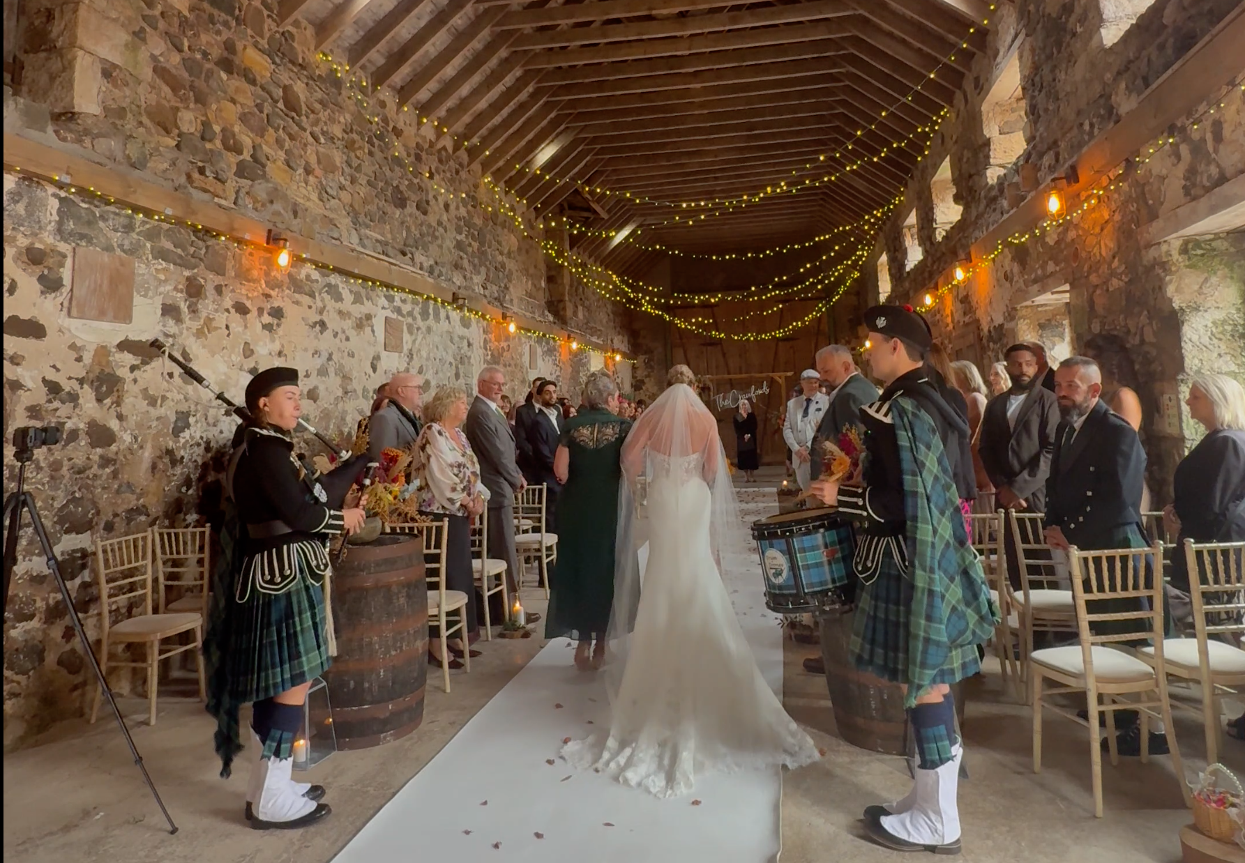 Bagpiper and Drummer performing as the Bride walks down the Aisle