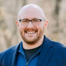 headshot of man smiling
