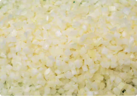 Close-up of finely diced yellow onions.