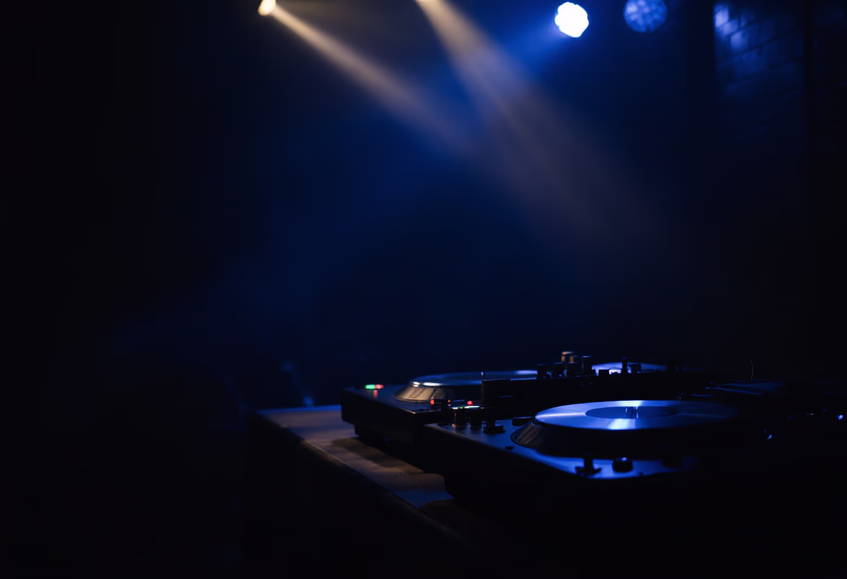 image of a dj setup in a dimly lit club