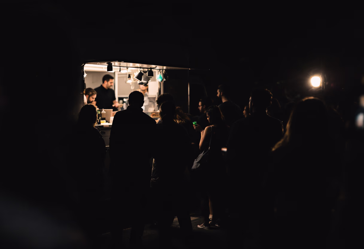 rear view of a food truck surrounded by an intimate crowd