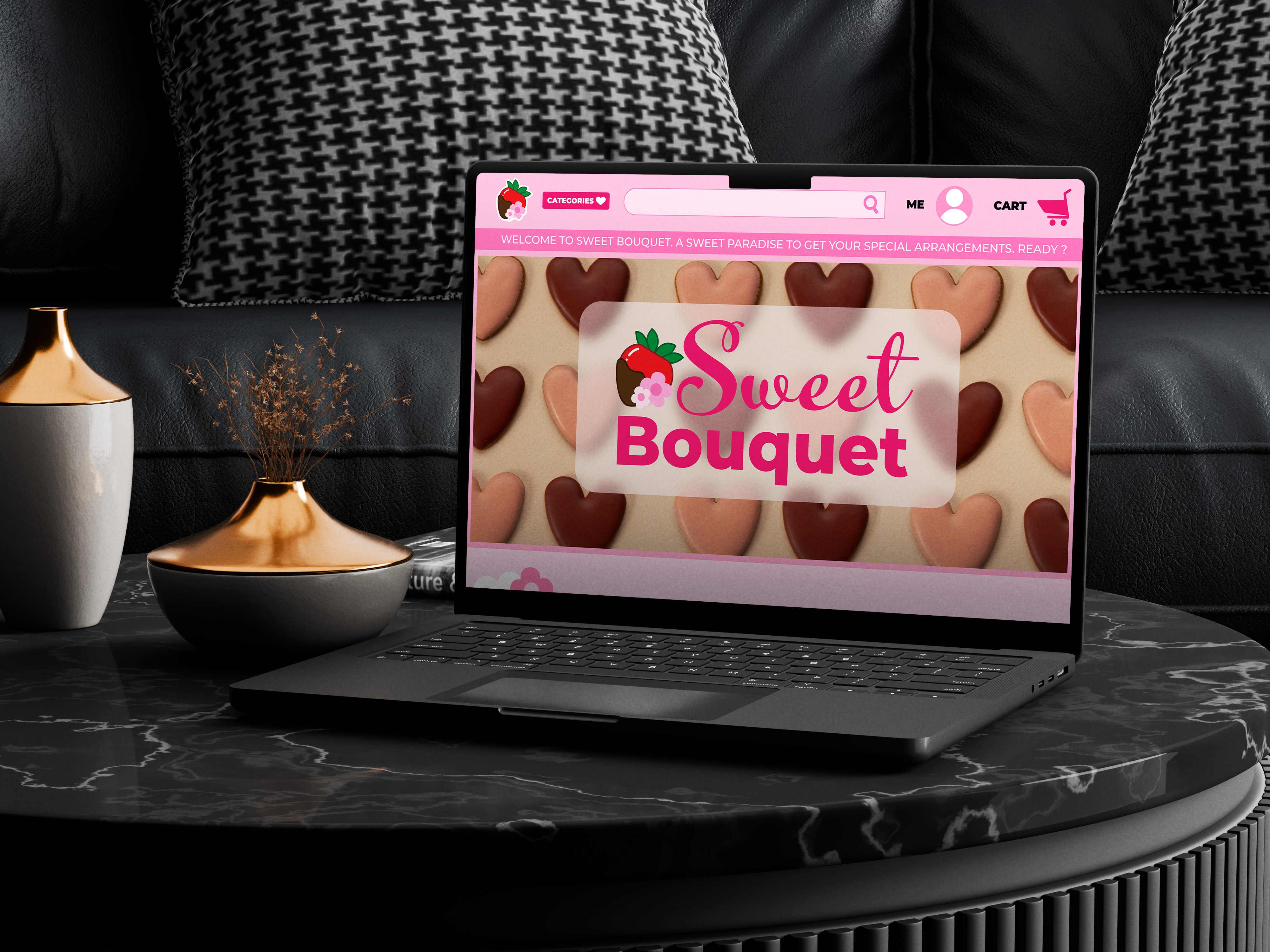 Laptop on black marble table displaying Sweet Bouquet website homepage with heart-shaped chocolates and pink interface.