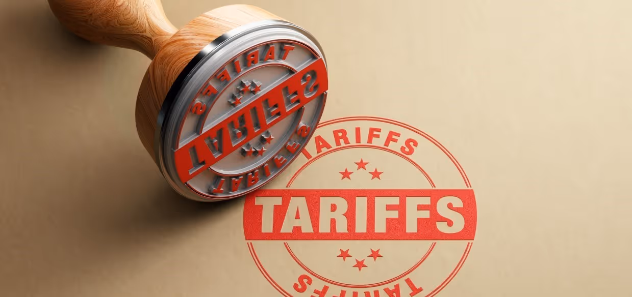 A rubber stamp with the word tariffs printed on it.