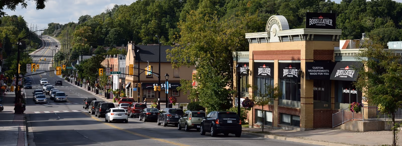 A city street filled with lots of traffic.