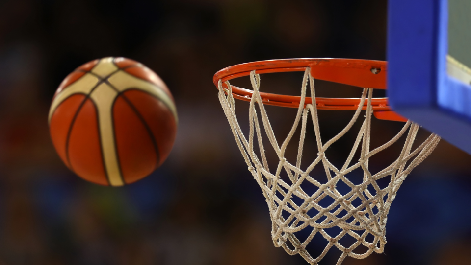 image of FIBA basketball going into hoop