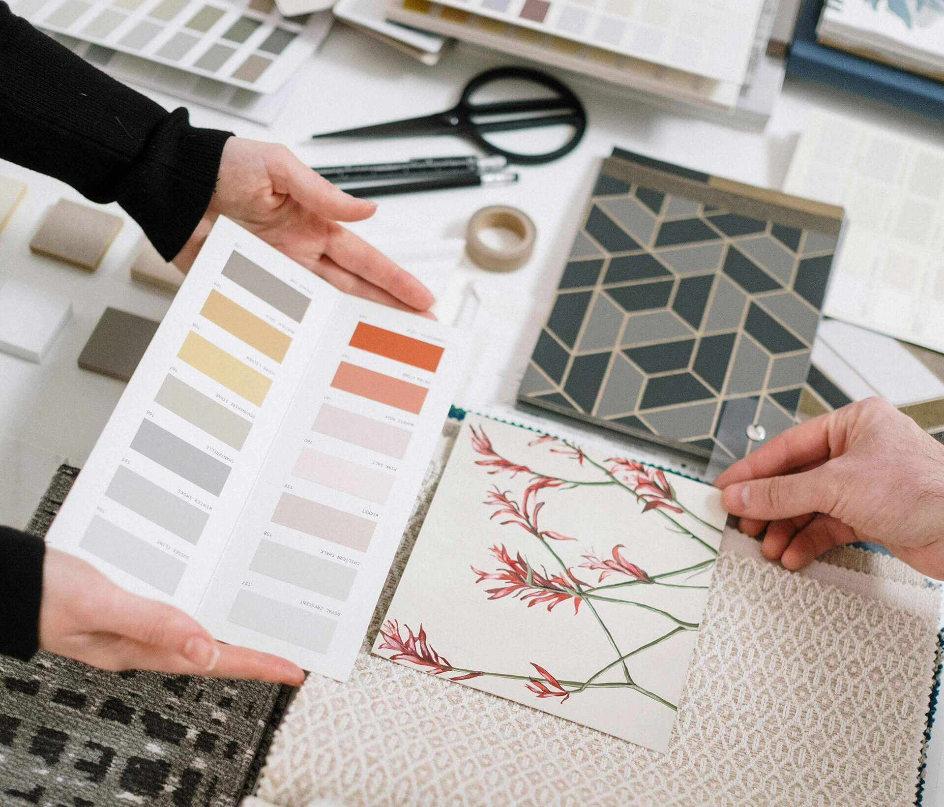Flat lay of mood board, color swatches, and sketches