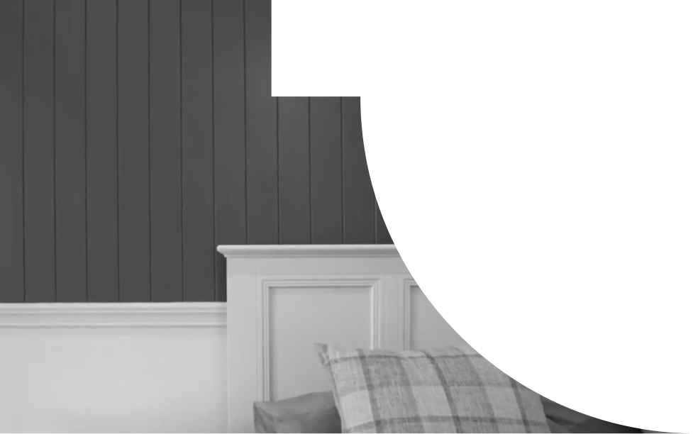 A close up detail image of some lining boards on a bedroom wall.