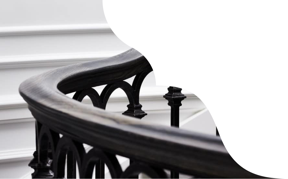 A close up detail image of an ornate handrail.