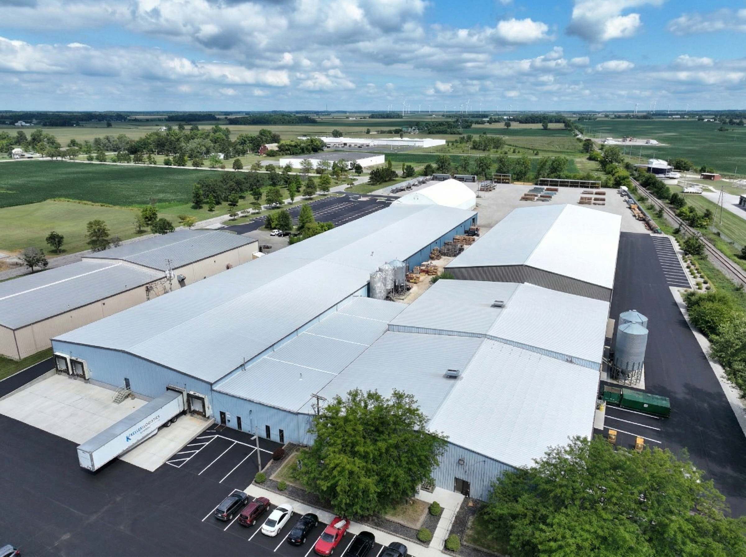 Aerial view of a manufacturing facility surrounded by farmland
