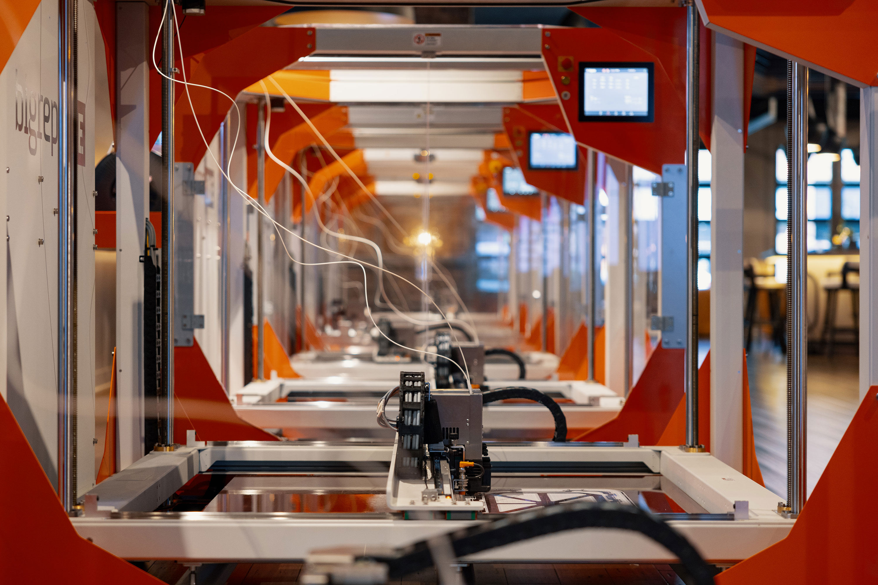 Rows of 3D printers in Kreate's design, engineering and testing lab